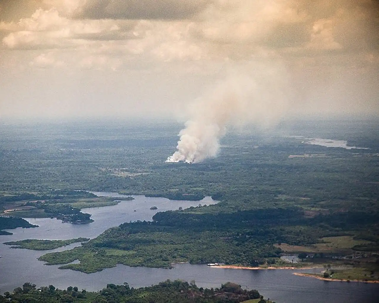 Image: The thick smoke seen in vegetation fires in the Amazon rainforest contains millions of ultrafine particles (diameters less than 50 nm), which could seed cloud droplets and intensify heavy rain in the atmosphere. Current understanding is that smoke from burning biomass does not include ultrafine particles although larger particles (>100 nm diameter) are known to be prevalent. Credit: Jason Tomlinson/Pacific Northwest National Laboratory